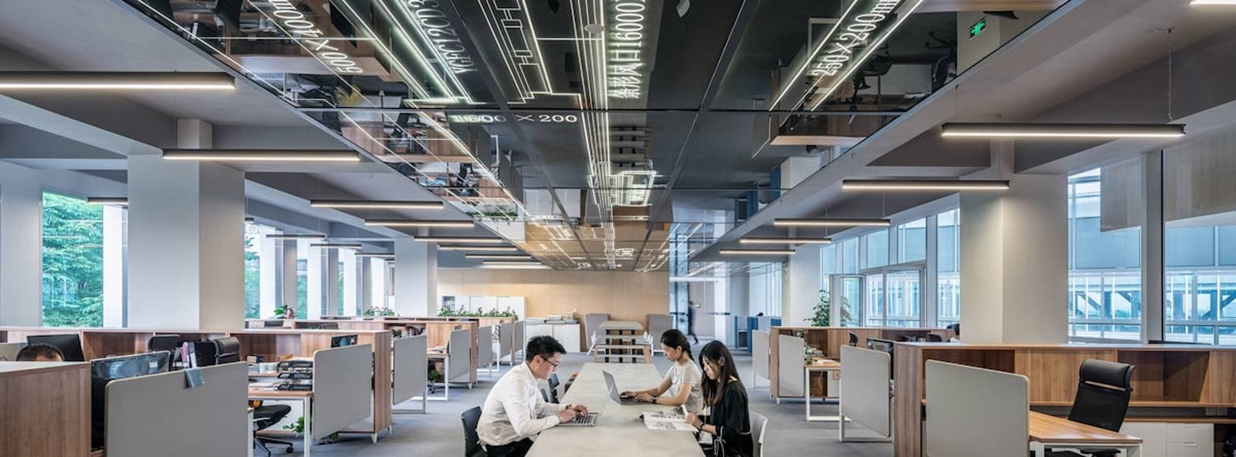 An open plan calling floor with agents working at their desks
